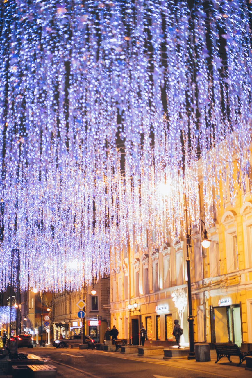 christmas illumination on city street in evening